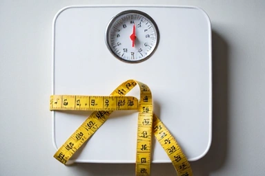 Mérleg és mérőszalag, súlykontroll program szimbólumai